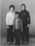 Black and white photograph of three cihldren standing together  in 1990s Hong Kong home – family memory animation