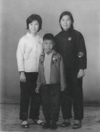 Black and white photograph of three cihldren standing together  in 1990s Hong Kong home – family memory animation