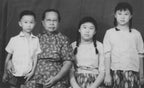 An AI animated family potrait at a photo studio 1960s Indonesia